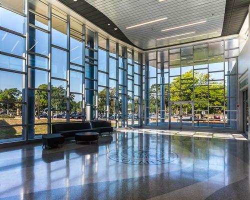 Frisch Welcome Center entry area with logo inset in terrazzo floor